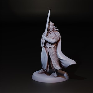 May include: A monochromatic figurine of a king holding a sword. The figure is wearing a crown, chainmail, and a flowing cape. The statue stands on a circular base against a dark background. The sword is held upright.