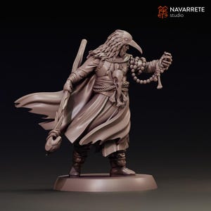 May include: A 3D-printed figurine of a figure in flowing robes, a bird-like mask, and a staff. The figure is holding a string of beads and has skull and bone accents. The figurine is on a circular base and is a neutral colour.