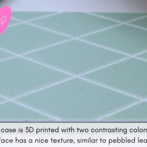 Top view of mint green diamond-pattern birth control pill case – features diamond texture and contrasting white trim in a soft, preppy pastel style.