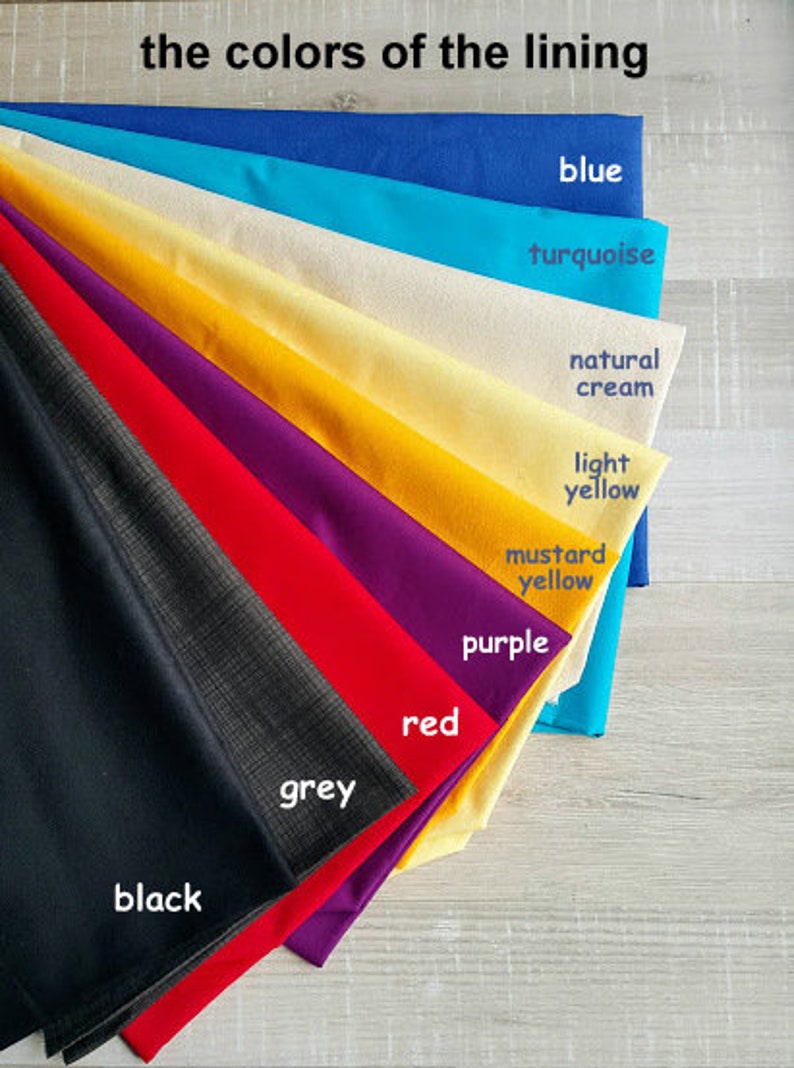 May include: A collection of fabric swatches in various colors, including black, grey, red, purple, mustard yellow, light yellow, natural cream, turquoise, and blue. The swatches are arranged in a fan shape, with the darkest color at the bottom and the lightest color at the top. The text "the colors of the lining" is written at the top of the image.