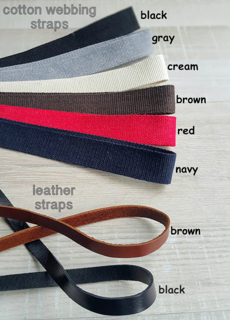 May include: Assortment of cotton webbing straps in black, gray, cream, brown, red, and navy.  Leather straps in brown and black.