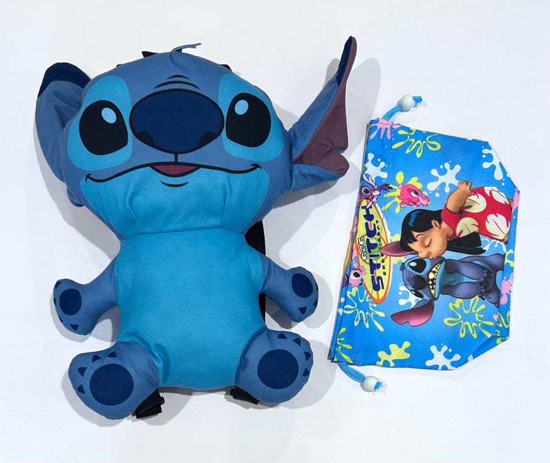 May include: A blue Stitch plush backpack with a matching blue drawstring bag. The backpack features Stitch's face and body. The drawstring bag has a blue background with a graphic of Lilo and Stitch. The bag has a white drawstring.