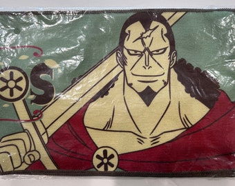 May include: A green and brown fabric patch with a cartoon image of a man with a scar on his forehead. He is wearing a red and yellow robe and holding a sword. The text "OS" is visible in the upper left corner of the patch.