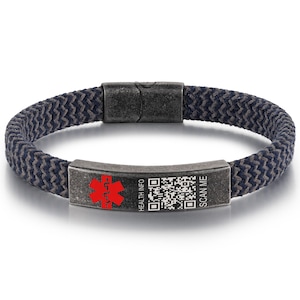 May include: A medical ID bracelet with a woven navy and gray band. The metal plate features a red medical symbol, a QR code, and the text "HEALTH INFO" and "SCAN ME". The bracelet has a magnetic clasp.