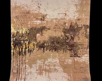 May include: Abstract rug with a distressed design in shades of beige, brown, and gold. The rug features a textured appearance with a mix of light and dark tones, creating a layered effect. Vertical black lines add a contrasting element.