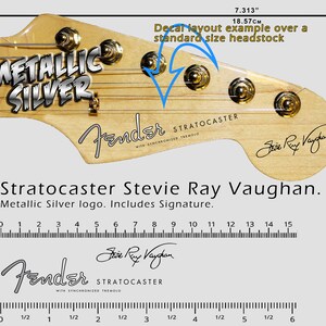 May include: A Fender Stratocaster guitar headstock with a metallic silver Stevie Ray Vaughan signature decal. The decal includes the text "Metallic Silver" and "Stevie Ray Vaughan". The headstock is 7.313 inches (18.57 cm) long.