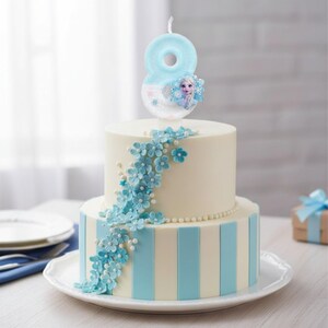 May include: A two-tier cake decorated with vertical light blue and white stripes, adorned with a cascading arrangement of small blue flowers and white pearls. A light blue number eight candle featuring a character graphic sits on top.