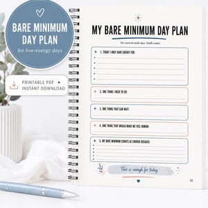 May include: A spiral-bound planner page titled My Bare Minimum Day Plan with sections for daily tasks, energy levels, and self-care. The layout features blue and orange text, bullet points, and the handwritten-style phrase This is enough for today.