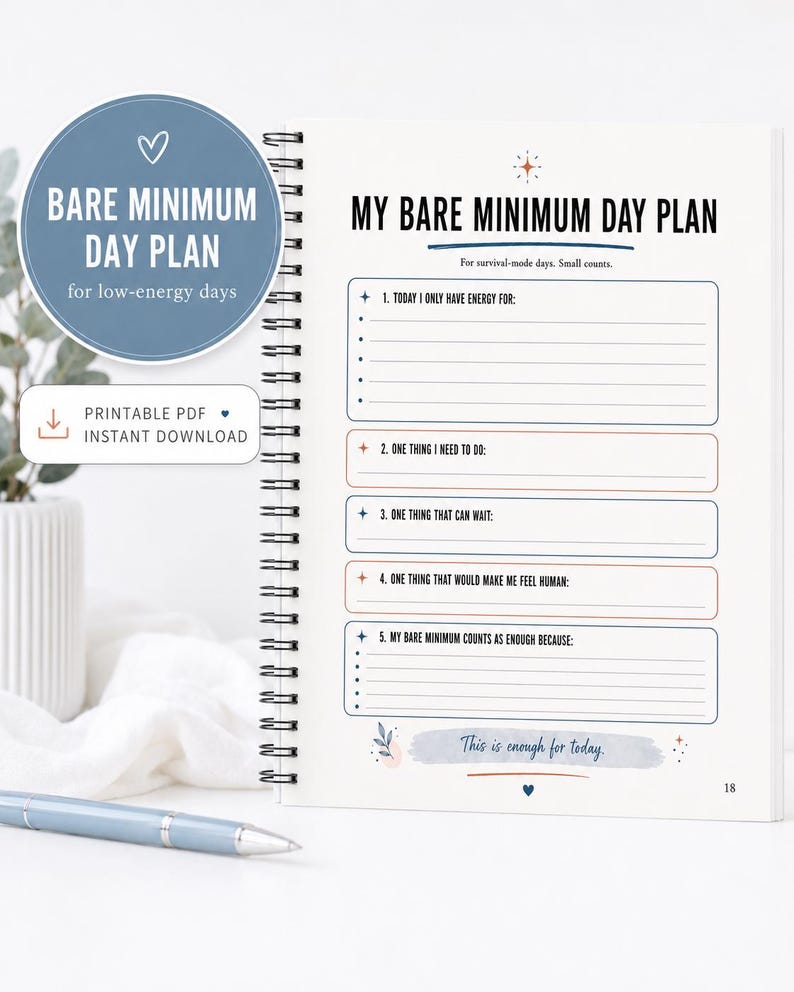 May include: A spiral-bound planner page titled My Bare Minimum Day Plan with sections for daily tasks, energy levels, and self-care. The layout features blue and orange text, bullet points, and the handwritten-style phrase This is enough for today.