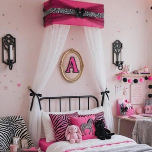 May include: A bed canopy featuring a hot pink fabric top with a black and white zebra print band and a central bow, draped with sheer white curtains. The bed includes zebra print and pink pillows, a pink plush rabbit, and a black plush cat.