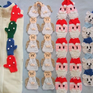 May include: A set of three crocheted scarves featuring different holiday themes. The first scarf is made of white and features angels, the second scarf is red and white and features Santa Claus, and the third scarf is blue and white and features polar bears.