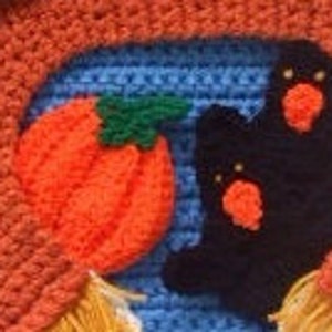 May include: A crocheted Halloween wreath with orange, blue, and black yarn. The wreath features a pumpkin, two ghosts, and a witch's hat.