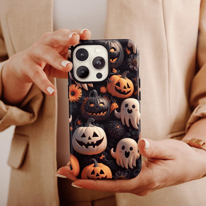 May include: A black phone case with a Halloween theme. The case features a variety of pumpkins, ghosts, and other spooky designs. The case is made of durable plastic and has a matte finish.