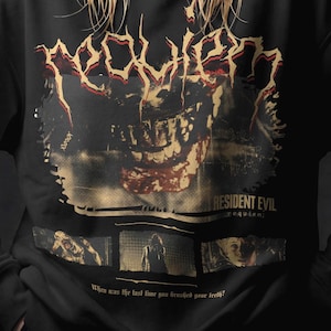 Może przedstawiać: Czarna bluza z nadrukiem graficznym z napisem "Requiem" w zniszczonej czcionce, wraz z obrazami z "Resident Evil". Projekt zawiera twarz potwora i tekst "When was the last time you brushed your teeth?"