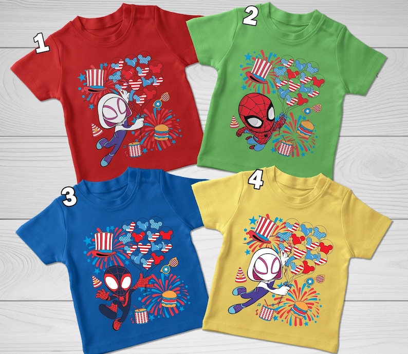 May include: Four short-sleeved t-shirts in red, green, blue, and yellow, each featuring a graphic print of a superhero character holding a bunch of balloons, a top hat, fireworks, and a burger, with numbered labels one through four.