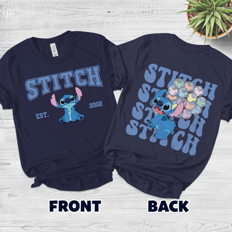 May include: A navy blue t-shirt featuring a graphic of the character Stitch. The front displays the text STITCH EST. 2002. The back shows Stitch holding a cluster of balloons with Mickey Mouse ear silhouettes, surrounded by repeating STITCH text.