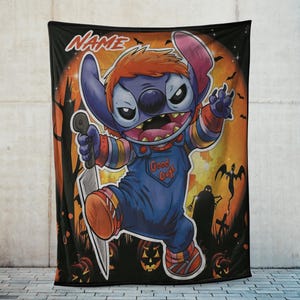 May include: A black Halloween-themed blanket featuring a cartoon character dressed as Chucky, holding a knife. The character is blue with orange hair and wearing blue overalls that say "Good Guys". The background includes pumpkins, bats, and a full moon.