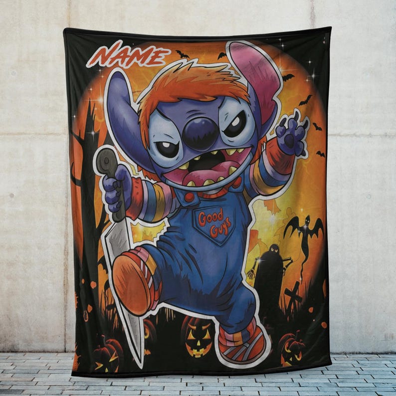 May include: A black Halloween-themed blanket featuring a cartoon character dressed as Chucky, holding a knife. The character is blue with orange hair and wearing blue overalls that say "Good Guys". The background includes pumpkins, bats, and a full moon.