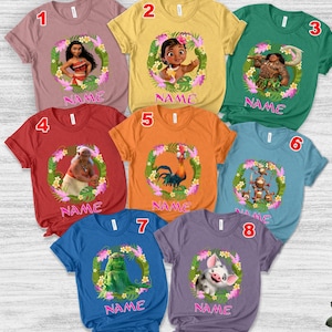 May include: Eight short-sleeved t-shirts in various colors, each featuring a unique Moana character graphic inside a floral wreath and the word NAME printed in pink. The shirts are numbered one through eight and display characters like Moana, Maui, Hei Hei, Pua, and Kakamora.