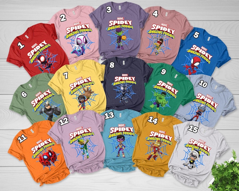May include: A collection of fifteen short-sleeved t-shirts in various colors, each featuring a Marvel Spidey and His Amazing Friends graphic with a character centered on a blue spiderweb and the show title text printed above in red and white.