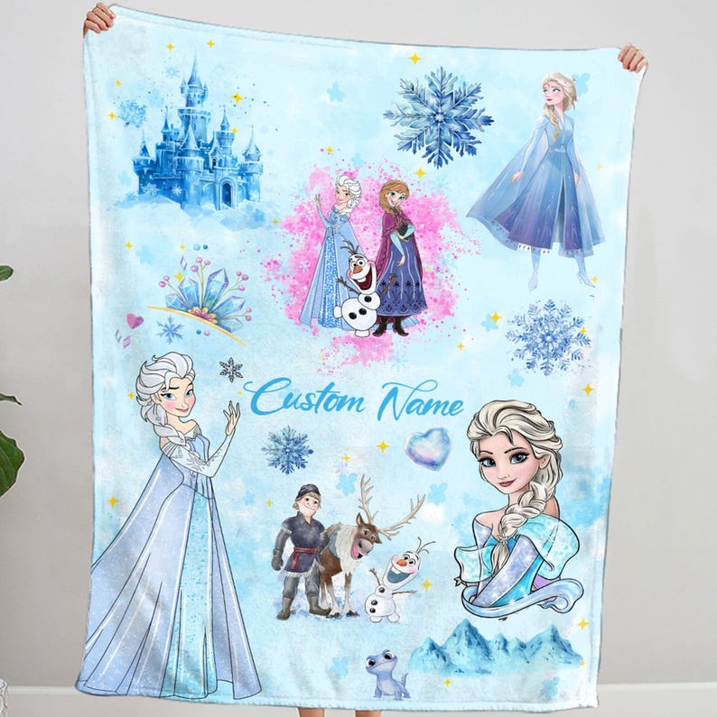 May include: A blue fleece blanket with a Frozen theme. It features images of Elsa, Anna, Olaf, and other characters from the movie. The blanket also has a snowflake design and the text "Custom Name".
