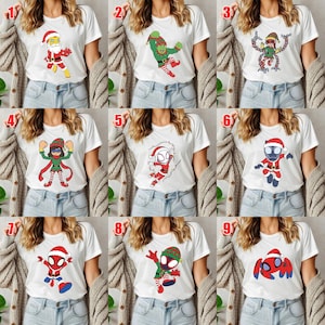 May include: A collection of nine white t-shirts, each featuring a unique graphic print of a character dressed in holiday attire. The designs include various figures in Santa or elf costumes, numbered one through nine in red text.
