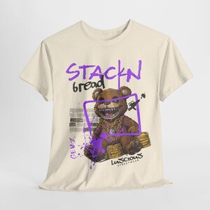Stackin Bread Teddy Graphic T-Shirt in Natural Color showcasing a unique teddy bear design. This trendy urban tee is ideal for streetwear lovers, offering bold graphics and a comfortable fit. A great addition to any wardrobe for men and women.