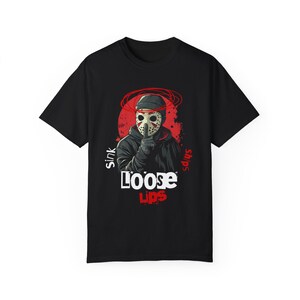 Loose Lips Sink Ships streetwear t-shirt with bold urban mask graphic and grunge accents. Perfect for street hustlers, hip-hop fans, and urban fashion enthusiasts. Printed on Comfort Colors 1717 tee for comfort, durability, and style.