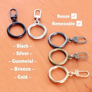 May include: Metal ring clasps in black, silver, gunmetal, bronze, and gold. The image includes the text "Reuse" and "Removable". These clasps are designed for easy attachment and detachment.