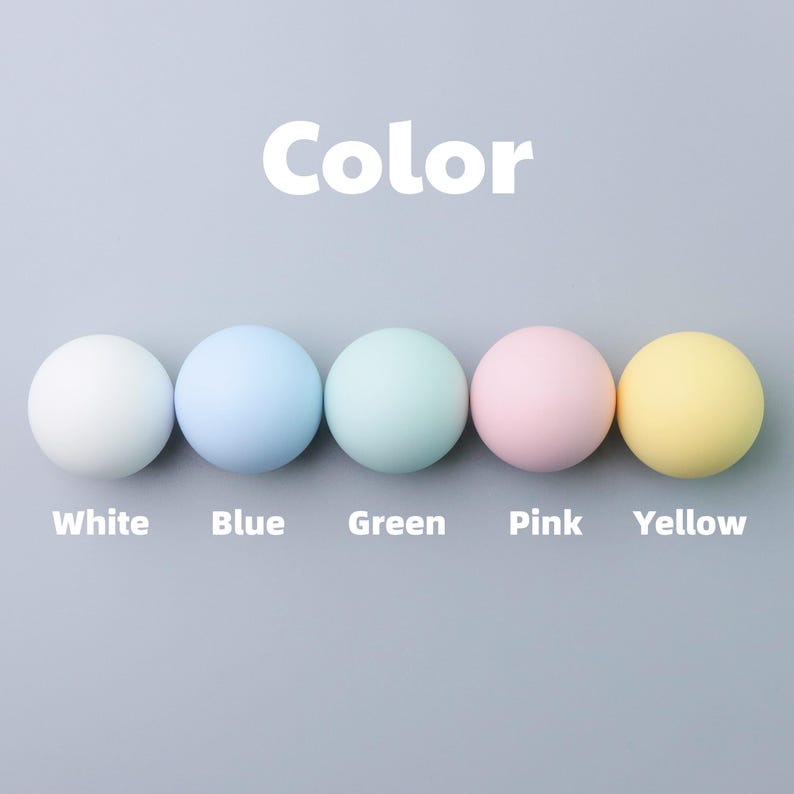 May include: A white ceramic mug with a black handle and the text "But First, Coffee" in a black, handwritten-style font. The mug is on a white surface.