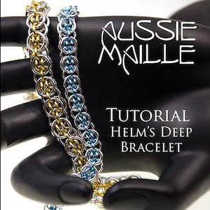 May include: Two chainmail bracelets, one gold and silver, the other silver and blue, are displayed. The bracelets are made of interlocking metal rings. The text "AUSSIE MAILLE" and "TUTORIAL HELM'S DEEP BRACELET" are visible.