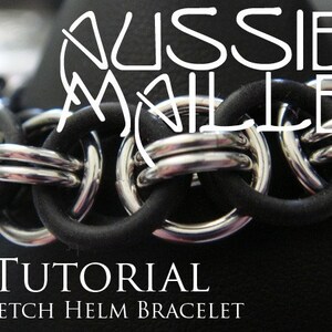 May include: A close-up of a stretch helm bracelet. The bracelet features silver-colored metal rings linked together with black rubber tubing. The text "Aussie Maille" is at the top, and "Tutorial Stretch Helm Bracelet" is at the bottom.