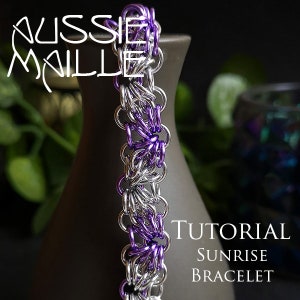 May include: A handmade chainmail bracelet with alternating silver and purple rings. The bracelet is displayed on a dark vase. The image includes the text "Aussie Maille" and "Tutorial Sunrise Bracelet".