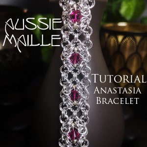 May include: A silver chainmail bracelet with pink beads. The bracelet is called the Anastasia Bracelet and is a tutorial for making it.