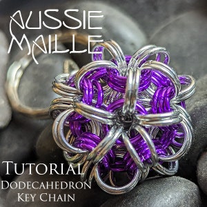 May include: A silver and purple dodecahedron keychain made with chainmail. The keychain is a tutorial for making a dodecahedron keychain.