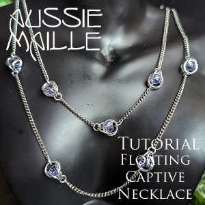 May include: A silver chain necklace with a tutorial for a floating captive necklace. The necklace has five blue glass beads encased in silver wire.