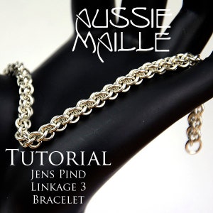 Op de afbeelding: Zilveren kettingmail armband tutorial, met het Jens Pind Linkage 3 patroon. De armband wordt getoond op een zwarte mannequin hand.