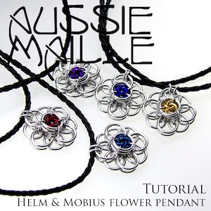 May include: Tutorial for making a Helm & Mobius Flower Pendant. Five silver pendants are shown, each with a different coloured centre: purple, blue, gold, red, and blue. The pendants are hanging from black cords.