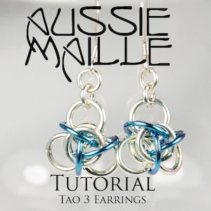 May include: A pair of silver earrings with blue and silver chainmail-style pendants. The earrings are labelled "TUTORIAL  TAO 3 EARRINGS".