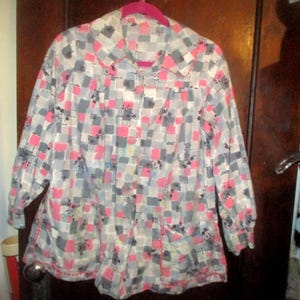 May include: A set of three ceramic mugs with a speckled, matte finish in cream, light brown, and dark brown. Each mug has a simple, minimalist design, ideal for coffee or tea.