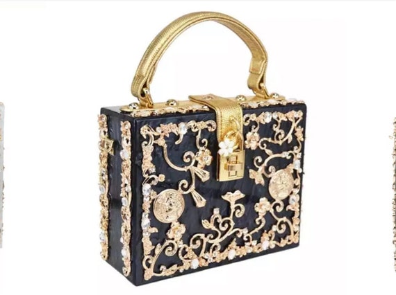 Black and Gold  and white and Gold acrylic finish handbag  embellished with rhinestones  and Baroque and Victorian  style designs