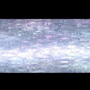 May include: Abstract rectangular design with a textured, iridescent surface. The pattern features a blend of light blue, white, and hints of pink, creating a shimmering effect. The design is set against a black background.