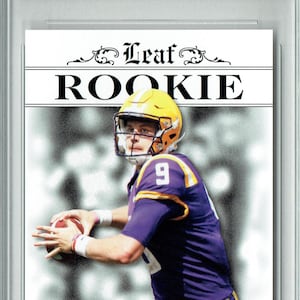 May include: A graded 2020 Leaf Rookie Card featuring Joe Burrow, a quarterback, in a purple and gold uniform. The card is graded a 10 Gem Mint by Pristine Grading International (PGI). The card has the word "ROOKIE" in large letters.