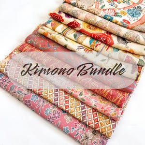 May include: A stack of colorful kimono fabric bundles. The fabrics feature various floral and geometric patterns in shades of red, pink, gold, and cream. The text "Kimono Bundle" is overlaid on the fabrics.