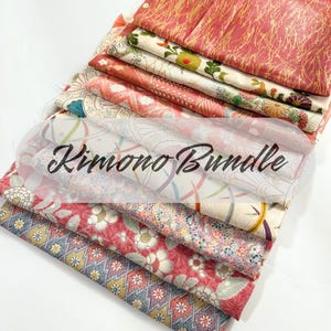 May include: A stack of colourful fabric scraps with floral and geometric patterns. The fabric is labelled "Kimono Bundle".