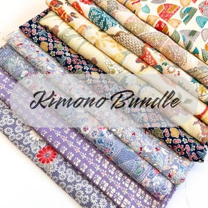 May include: A bundle of rolled fabric with various floral and geometric patterns in shades of blue, purple, red, and cream. The text "Kimono Bundle" is overlaid on the fabric.