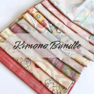 May include: A stack of folded kimono fabric pieces in various colors, including red, pink, yellow, and green. The fabrics have floral and geometric patterns. The text "Kimono Bundle" is overlaid on the image.