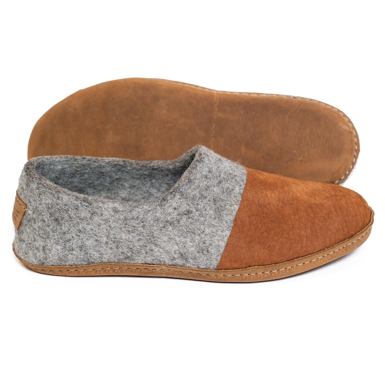 These BureBure handmade felted wool slippers for men are crafted entirely from natural wool. The natural felted wool offers a massaging effect on the skin and prevents sweating, keeping feet cool in warm and cozy in colder weather.