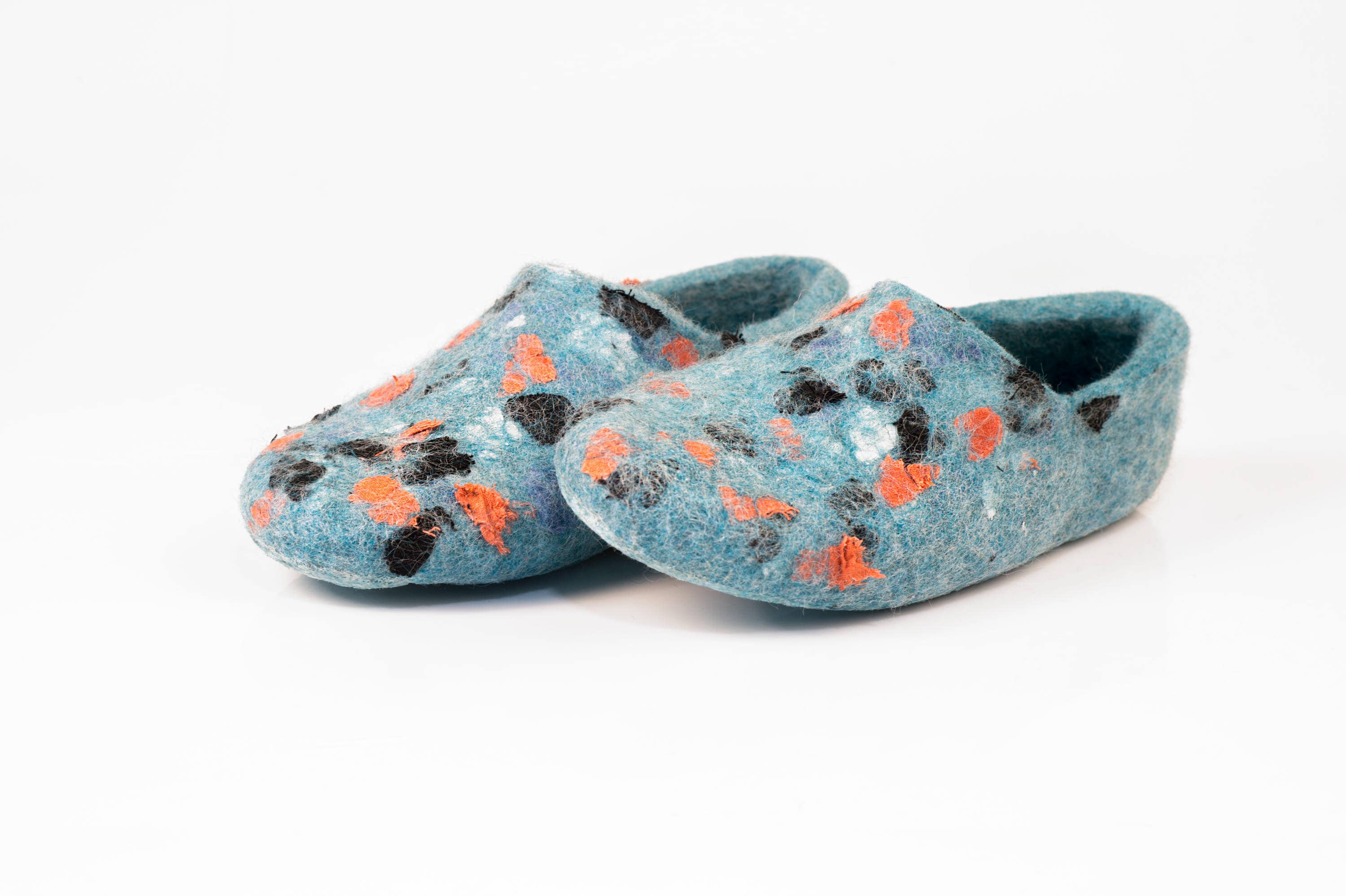 Natural felted wool slippers decorated 