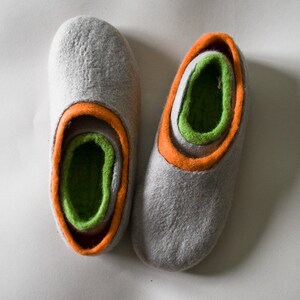 2 pairs of matching BureBure felted wool slippers are designed for mom and daughter, dad and son. The inner part of these slippers is made of yellow semi soft wool while the outer part is decorated with natural beige alpaca wool.